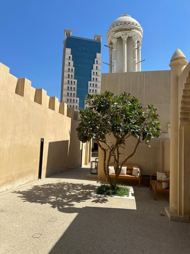 Adobe-style architecture in desert tones blending harmoniously with the natural surroundings