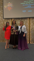 Claire presenting award to artist from Kuwait during gala night at One&Only Royal Mirage