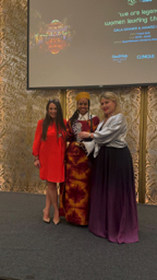 Award moment with artist from Ivory Coast receiving recognition from Claire Ordovsky Tanaevsky