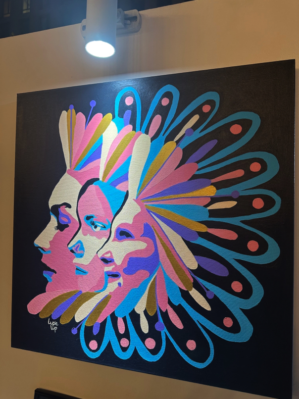 Pop-art style painting from Colombia — dual-profile composition with radial bursts, symbolizing layered personality and emotion