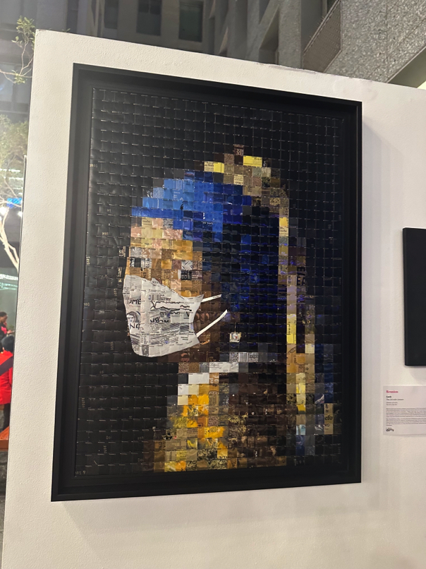 Sustainable art by Reunion — Portrait created entirely from recycled cans, merging environmental design with storytelling.