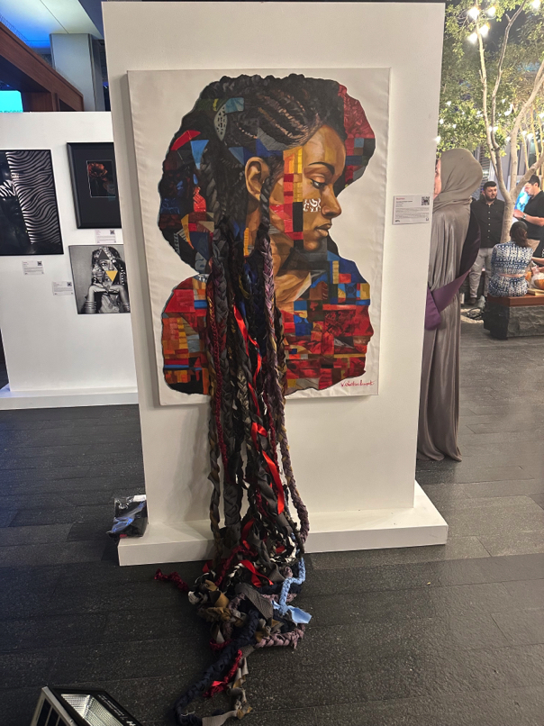 Mauritian artwork — Sculptural interpretation of identity using vibrant woven fabric and abstract mask.