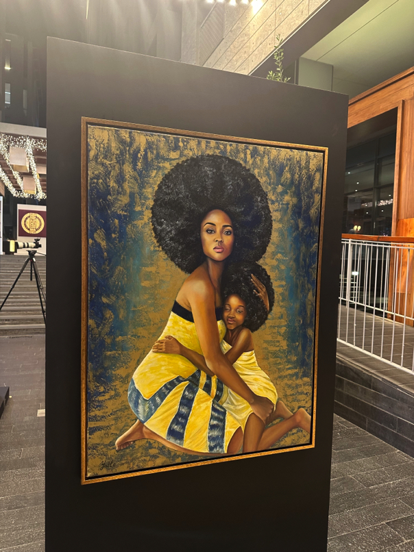 Artwork by Tatyana Yatlo (Ukraine) — Bold mixed-media portrait of a woman with voluminous hair and sunflower hues.