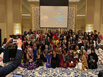 Group photo of international participants at the Art Connects Women gala at Royal Ballroom, One&Only Royal Mirage