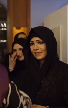 Close-up of Her Highness Sheikha Latifa during her visit to Art Connects Women, engaging with artists and attendees.