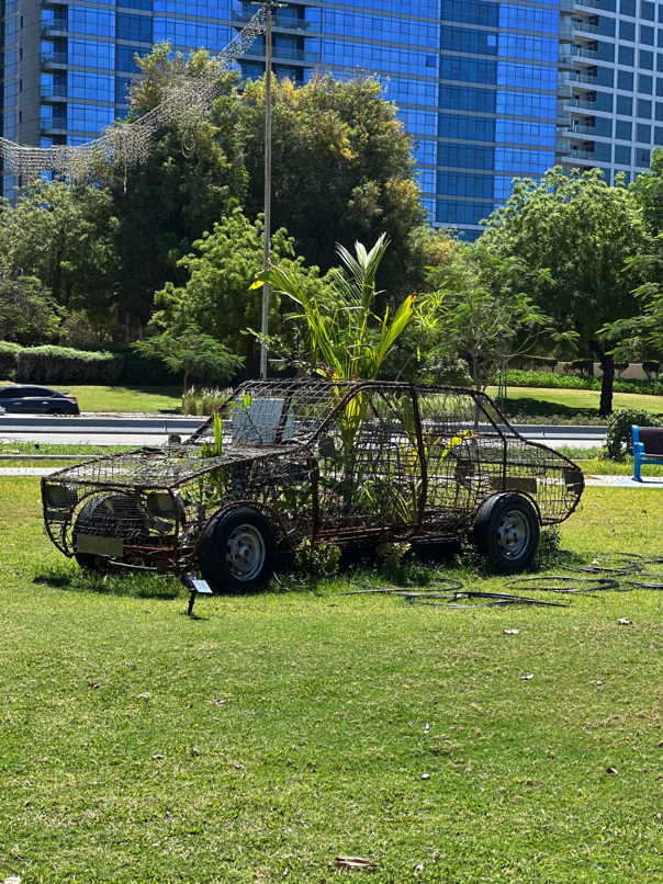 Outdoor art installation on lawn at Abu Dhabi Biennale 2025