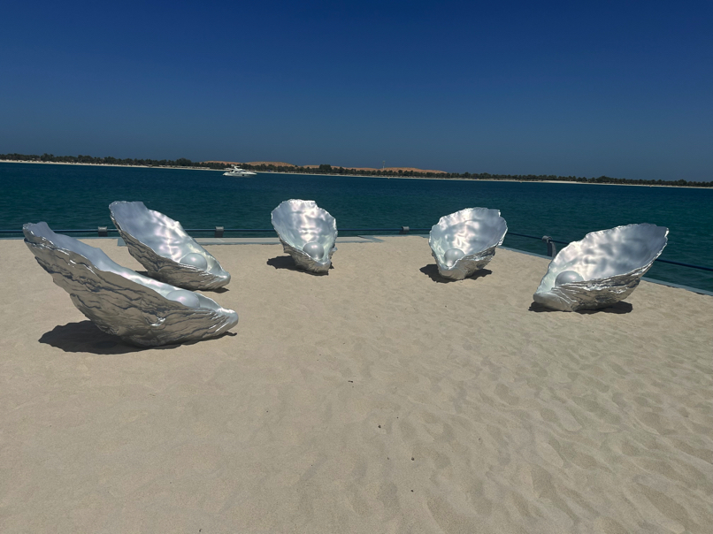 Sculptural shells on the beach — Abu Dhabi Biennale exhibit