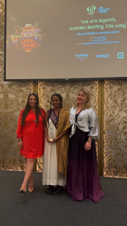 Claire presenting award to participant from Madagascar in national attire
